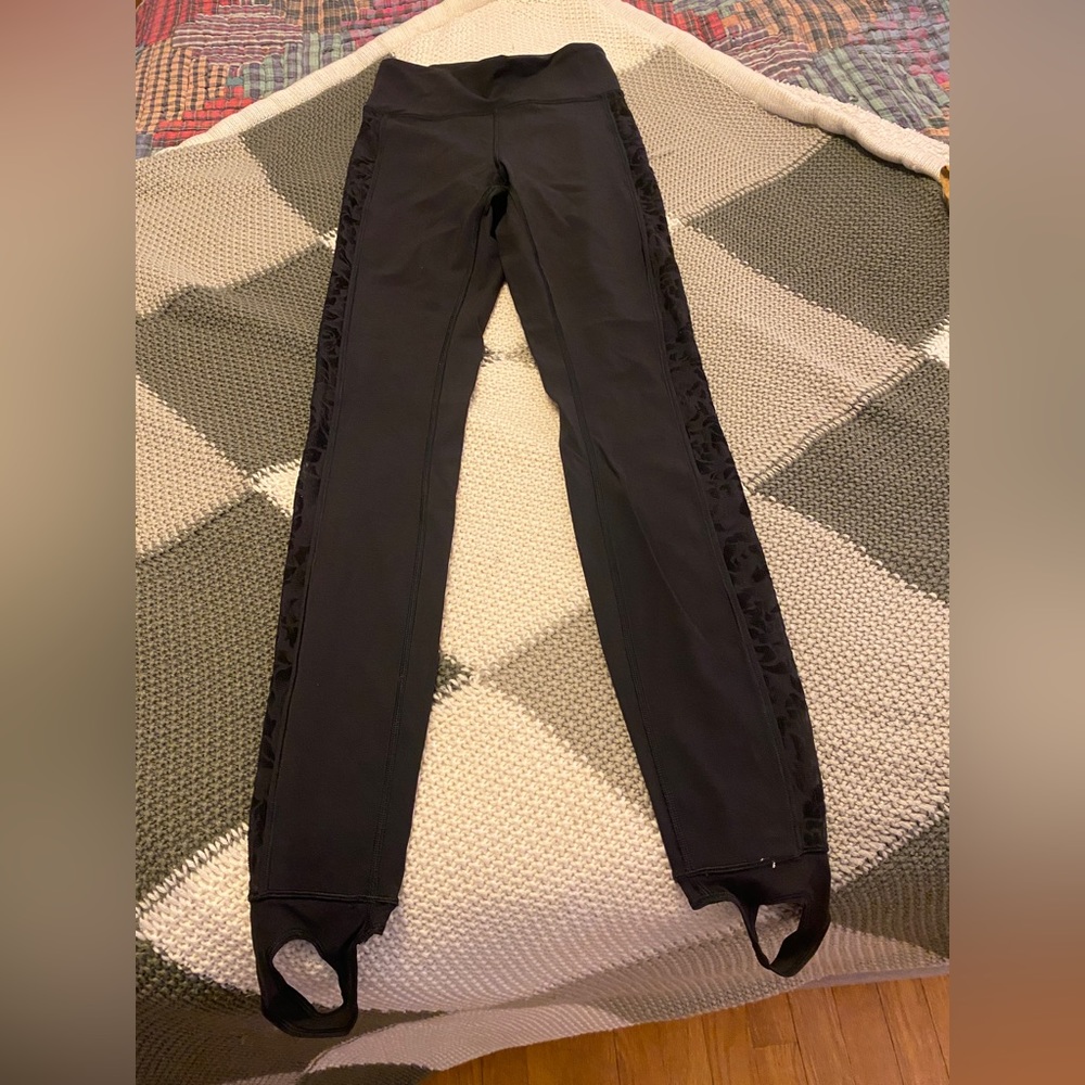 Lululemon size 4 black high rise stirrup leggings with mesh rose siding